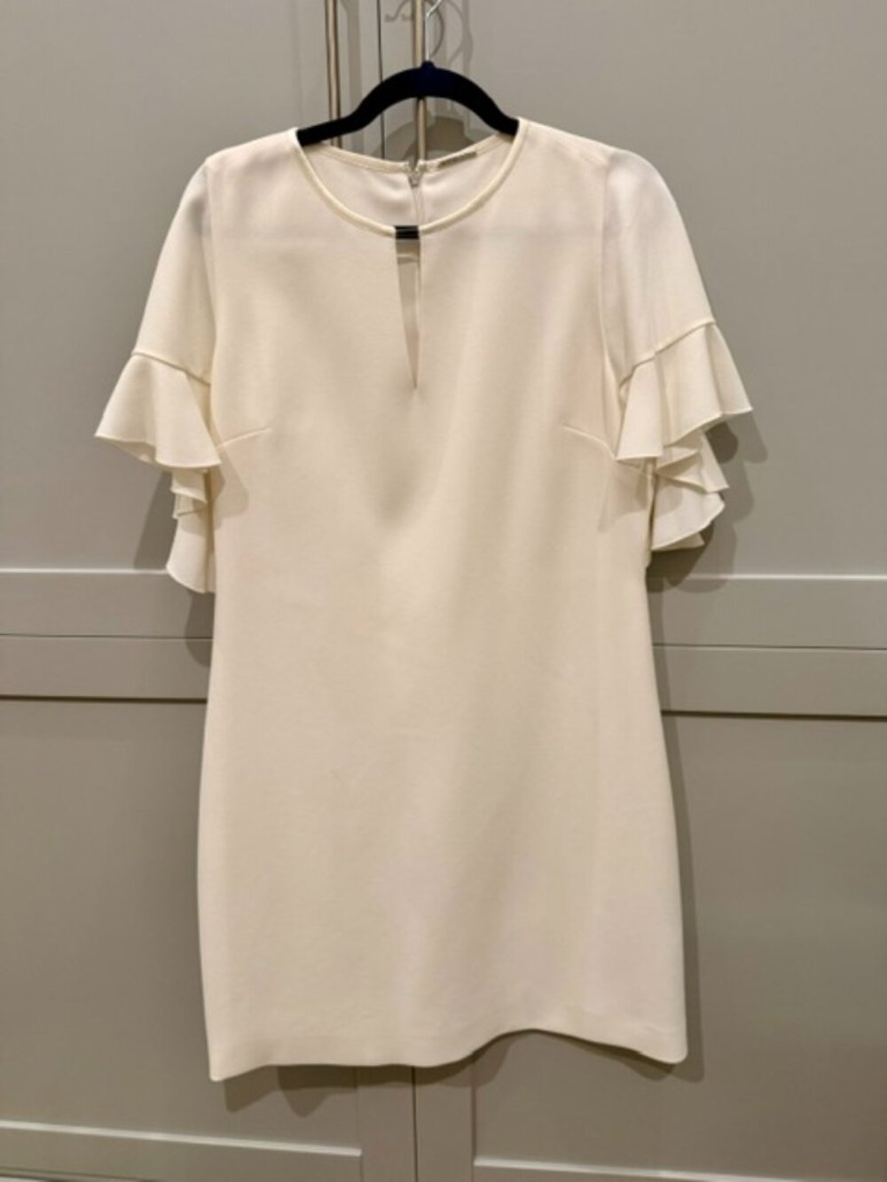 Elie Tahari Theodore Flutter Sleeve Sheath Dress in a cream/white shade.